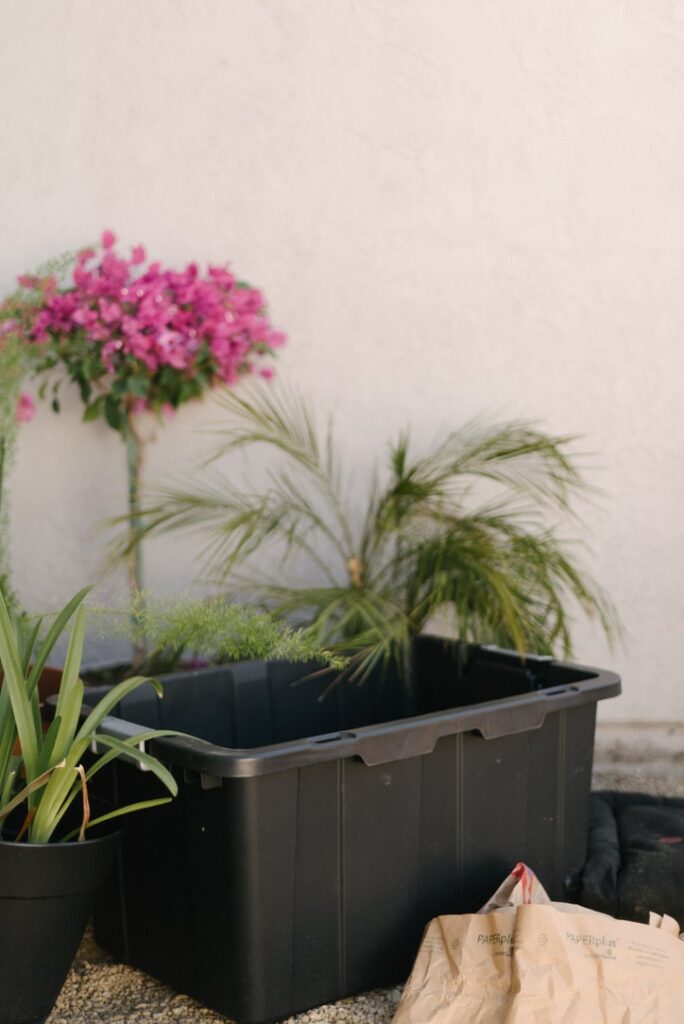 a DIY compost bin made from a plastic bin