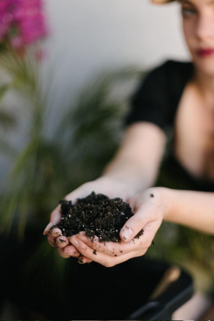 girl holding compost