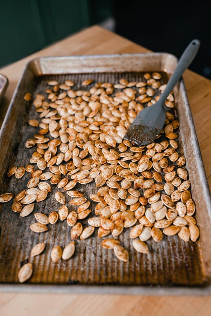 image of salted roasted pumpkin seeds on a baking tray